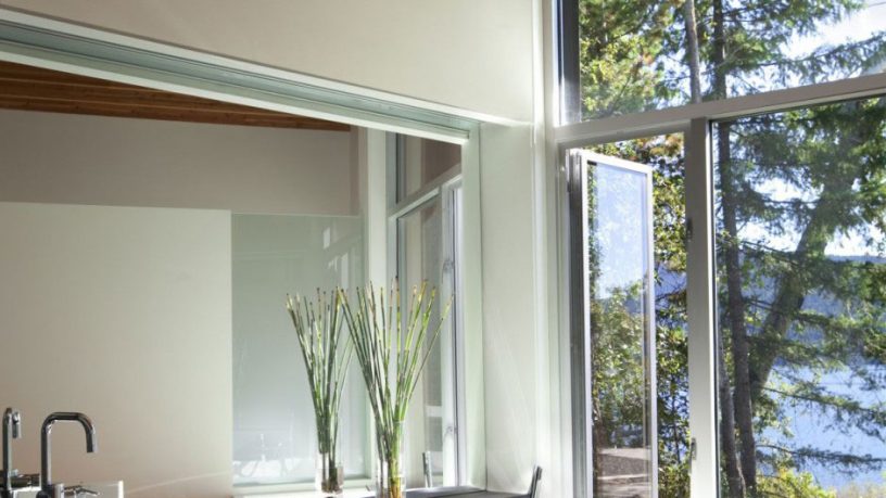 Bathroom with Aluminum Windows Overlooking the Lake Shuswap Cabin by Splyce Design