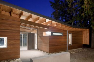 Front Door of a Mixture of Classic Style and Modern Wood Shuswap Cabin by Splyce Design