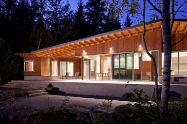 The Front Side of Shuswap Lake Cabin by Splyce Design Night Situation