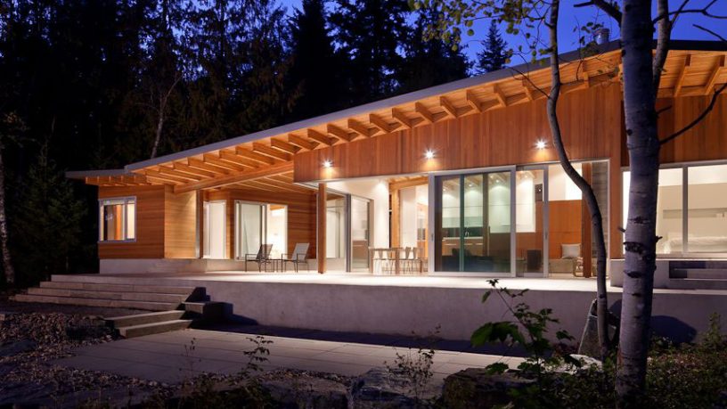 The Front Side of Shuswap Lake Cabin by Splyce Design Night Situation