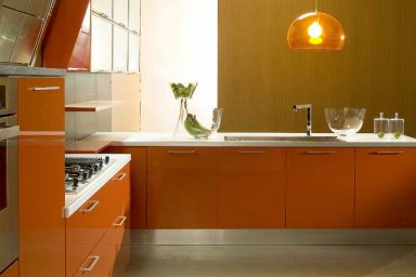 Di Lorio Cucine Orange Kitchen with Chandelier
