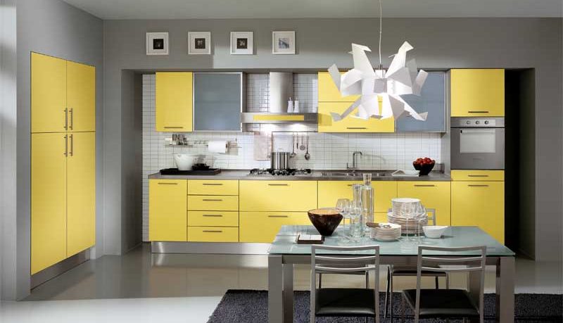 Modern Yellow Kitchen Design with Unique Chandelier and Black Rug