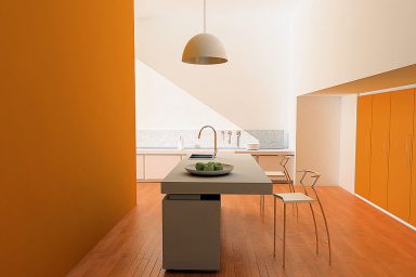 Simple And Minimalistic Orange Kitchen With Chandelier