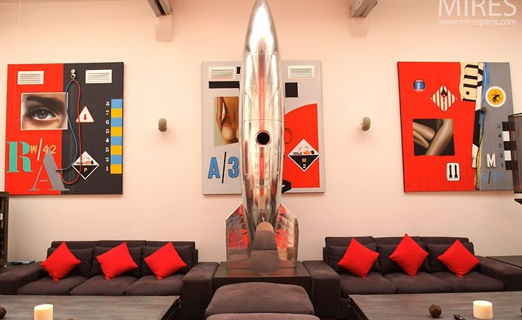 Amazing Metal Spaceship Sculpture and Red and Black Wall Art-in Paris Loft