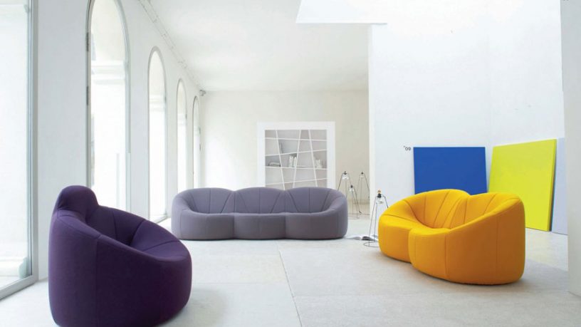 Pop Out Living Room with Big Cozy Couches and White Coloured Home