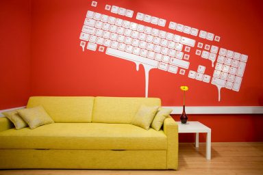 Yellow Couch with Mural Wallpaper Paint