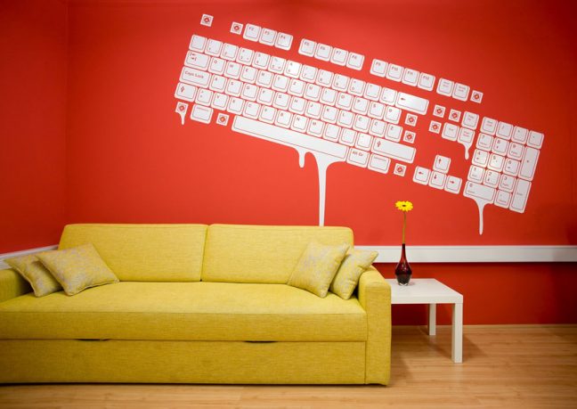 Yellow Couch with Mural Wallpaper Paint