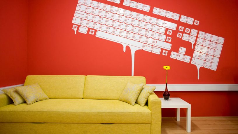 Yellow Couch with Mural Wallpaper Paint