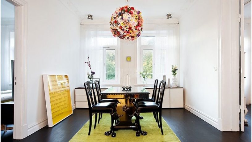 Floral Chandelier Dining Room with Green Rugs
