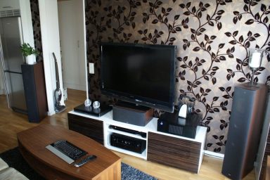 Modern LCD TV Room Design with Leaf Wallpaper
