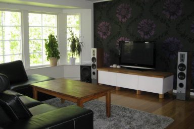 Simple Living Room TV with Floral Wallpaper