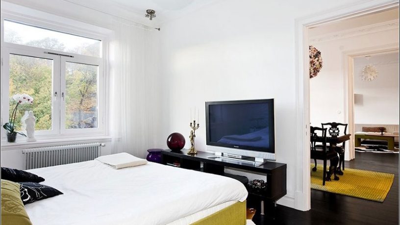Techy White Bedroom with LCD TV