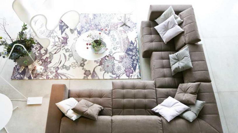 Busnesli Coffee Couch with Floral Rug