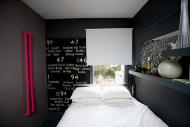Dark and Moody Bedroom Apartment with White Bed