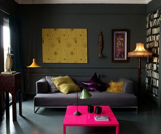 Dark and Moody Livinng Room Design with Pink Coffee Table