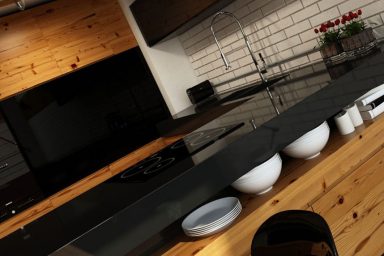 Futuristic Black Kitchen with Wooden Furniture