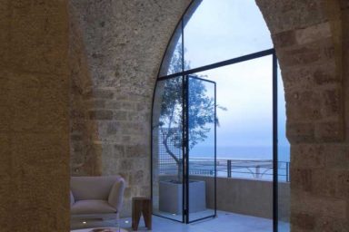 Living Room and Balcony with Striped Rug