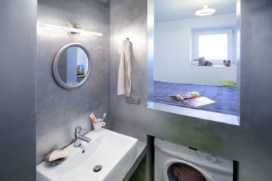 SpaceSaving Solutions with Washing Machine Under Sleeping Area