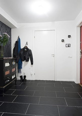 Apartment Interior Design that Combines Black and White Theme with Natural Wood
