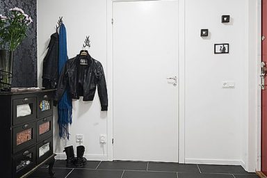 Apartment Interior Design that Combines Black and White Theme with Natural Wood