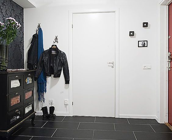 Apartment Interior Design that Combines Black and White Theme with Natural Wood