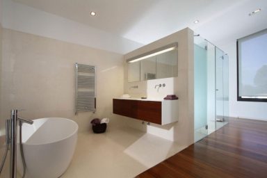 Clean Luxury Bathroom with Wood Floor