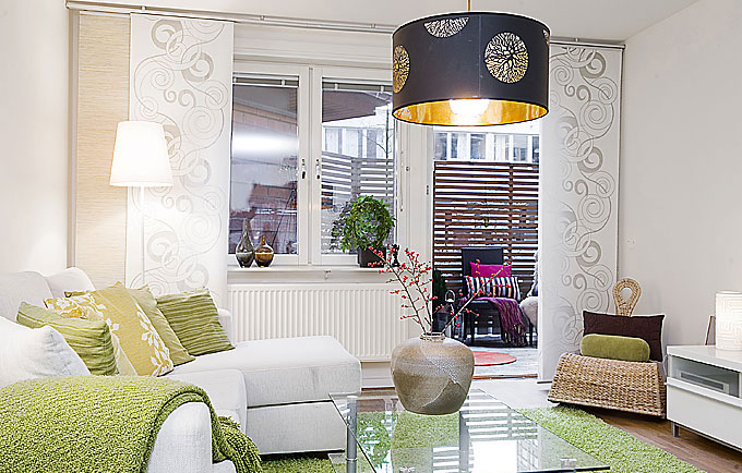 Minimaist Apartment Living Room with White Sofa and Green Rugs