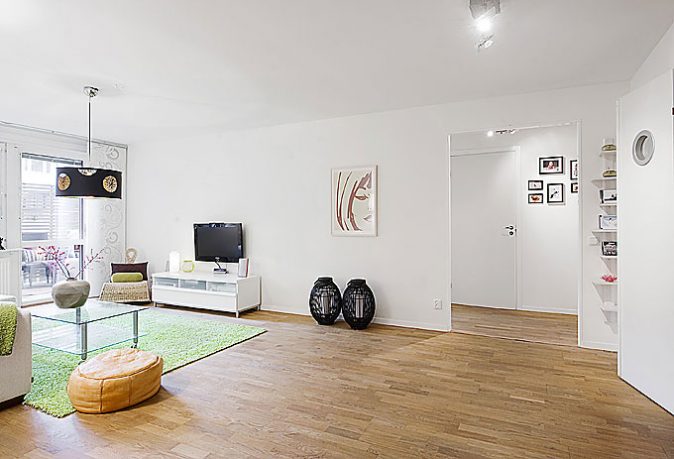 White Living Room Apartment with Black Chandelier and Wood Floor