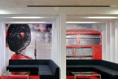 Meeting Room with Black Sofa and Red Bus Wall Decor