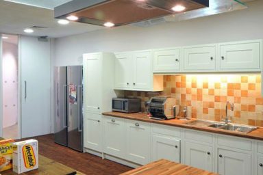 Moder Kitchen Design with Orange Tile Wall