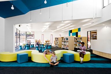 Colorful Elementary Library with Unique Wave Couch