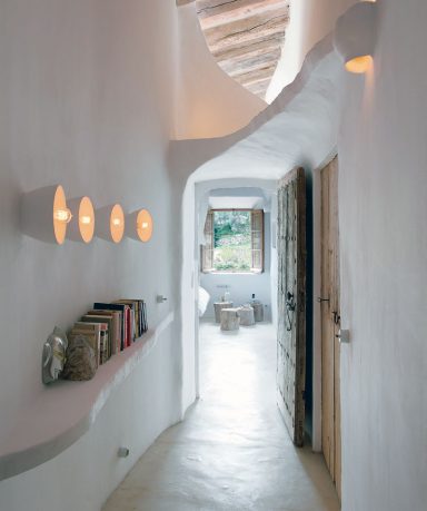 Unique Cave Home Hallway with Old Door Design