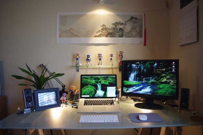 Minimalist Glass Workspace with Action Figure