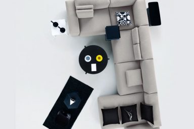 Modern Grey Modular Sofa with Black Pillow and Table