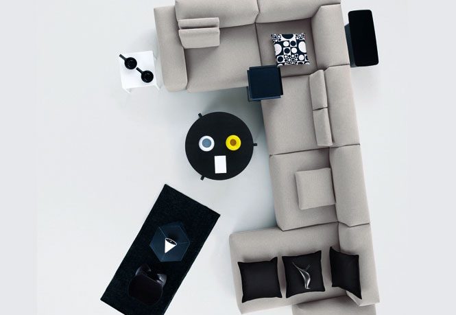 Modern Grey Modular Sofa with Black Pillow and Table