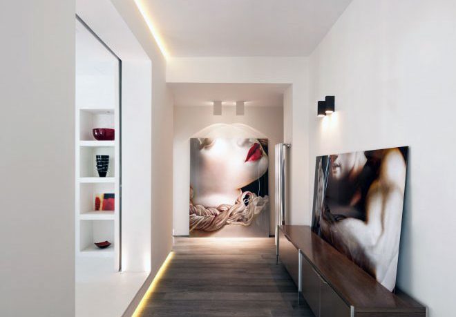 Modern Hallway with Recessed Wall Lighting and Wooden Floor