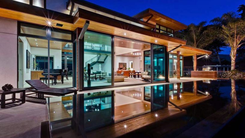 Living Room Across Pool with Large Expanses of Glass