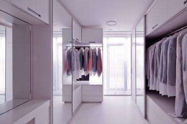 Modern Walk in Closet with Large Mirror