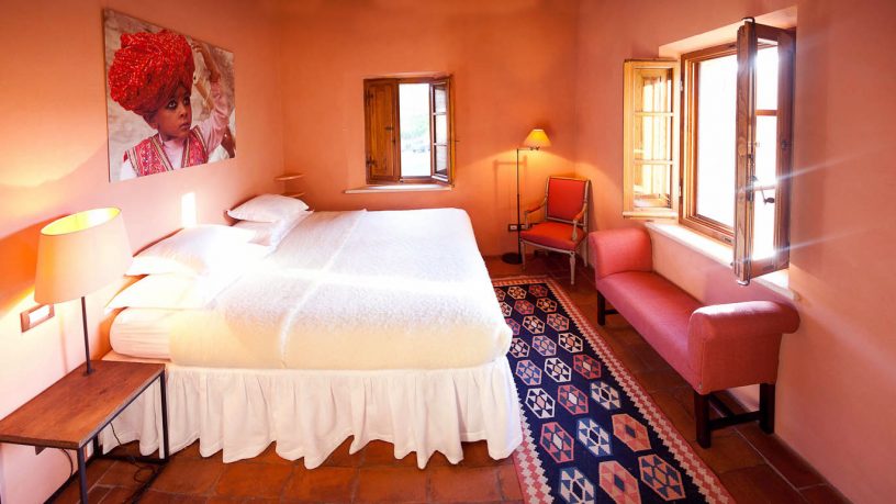 Orange Classic Bedroom with White Bed And Rusian Rug