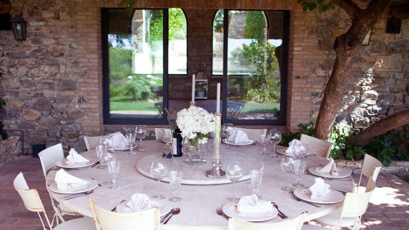 Outdoor Dining Room with White Table and Table Manner