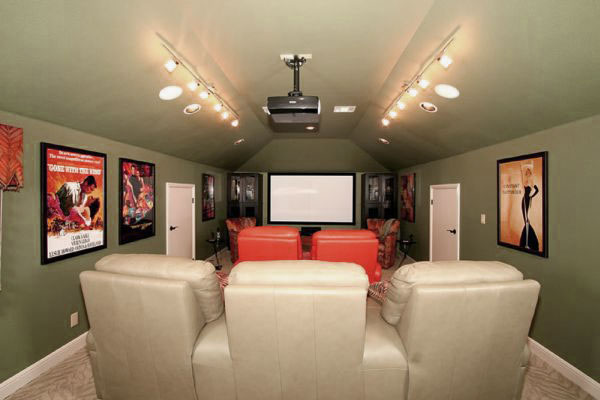 Captivating Movie Room with Green Wall Design