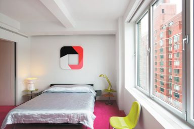 Master Bedroom with Pink Floor and Green Chair