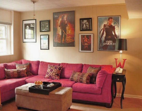 Small Movie Room Design with Pink Sofa and Movie Posters