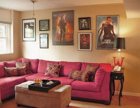 Small Movie Room Design with Pink Sofa and Movie Posters