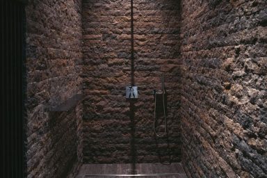 Stacked Stone Wall Bathroom Design