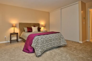 Warm bedroom with sliding door closet