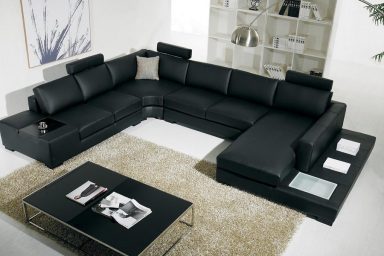 Black and white sectional sofa with table