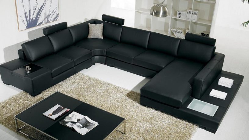 Black and white sectional sofa with table