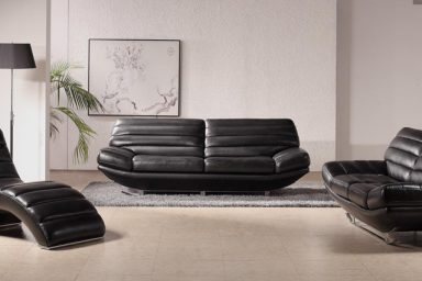 Black leather sofa in white living room