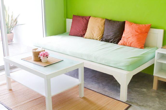 Colorful green room with couch